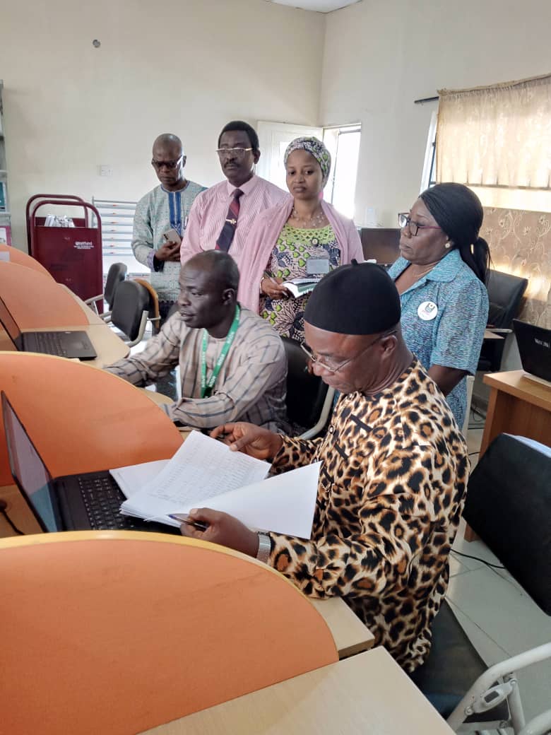 Accreditation team going through some documents at the centre