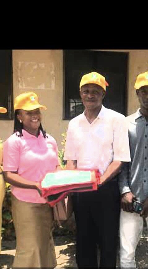 pix Ag: director,Owhrode Community Study Centre,Mrs.Roseline Omale (Left) presenting a souvenir to the registrar, Edjophe Area Customary Court,Mr.Rufus Chikezie,during the visit