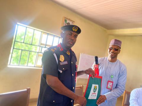 R-L: The centre director,Dr.Adamu Bappah presenting NOUN souvenir to the OC opreation of the Command Mr.Yahaya Muhammad Abubakar