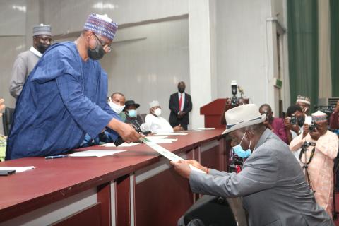Minister handing over appointment letter to Okebukola