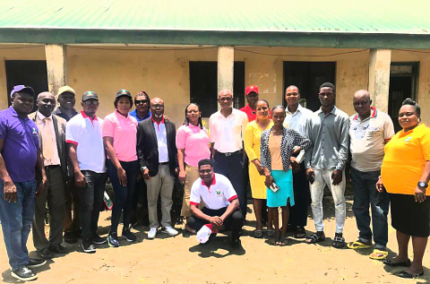 Omale (8th Left) and Chikezie (8th Right) in group photograph with the judiciary workers and some NOUN staff at the court premises