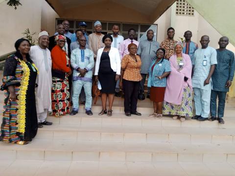 Centre director in a group photograph with the accreditation team